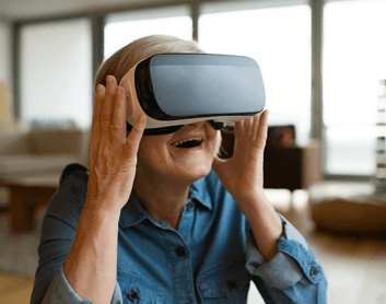 senior woman wearing VR glasses
