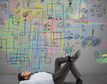 Man lying next to chalk drawing